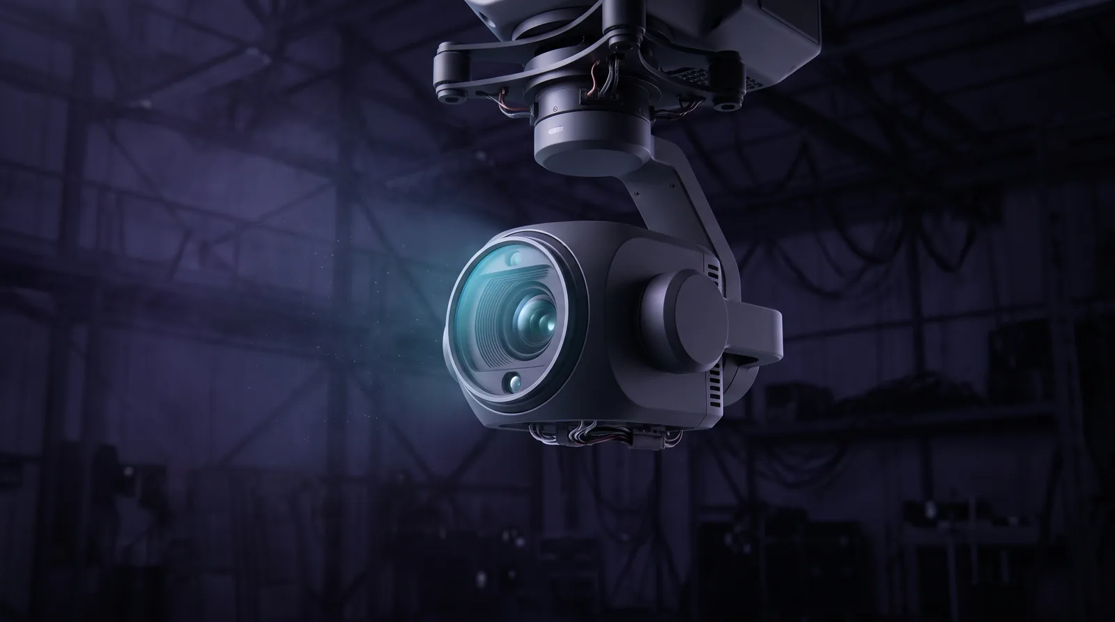 Close-up of a drone sensor head in a dark hangar, its gimbal-mounted optics facing the viewer.